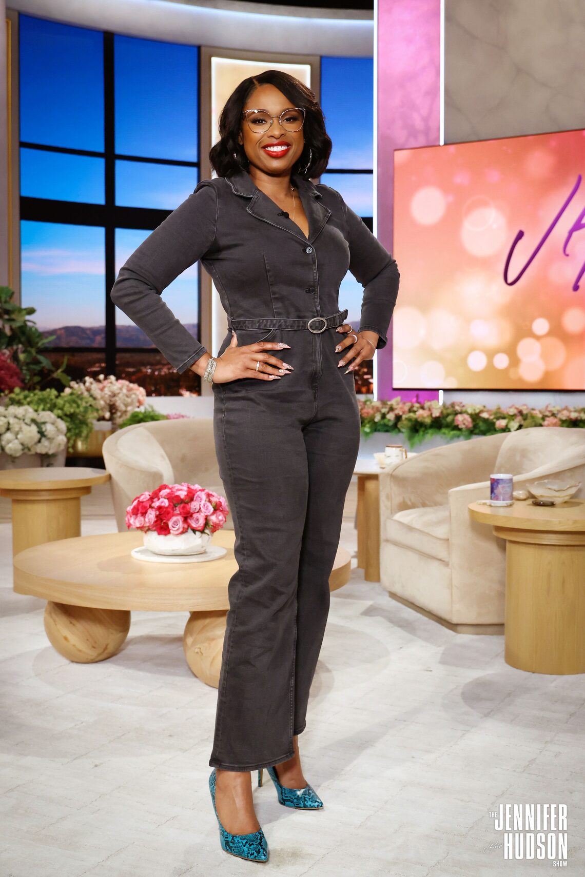 Jennifer chose a black denim jumpsuit from international brand & Other Stories and a pair of funky teal and black pumps on the January 31, 2024 show.